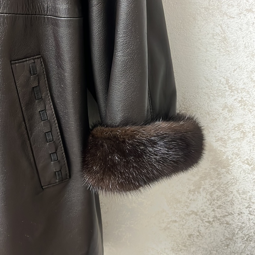 Like new mink and leather 3/4 coat. Genuine Choc brown leather with mink inside